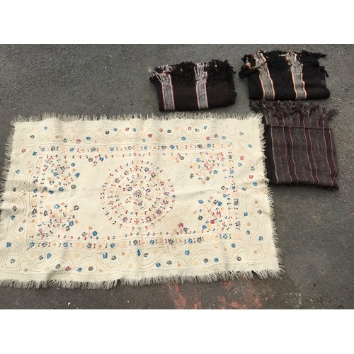 317 - Three Tribal Rugs and a felt Rug