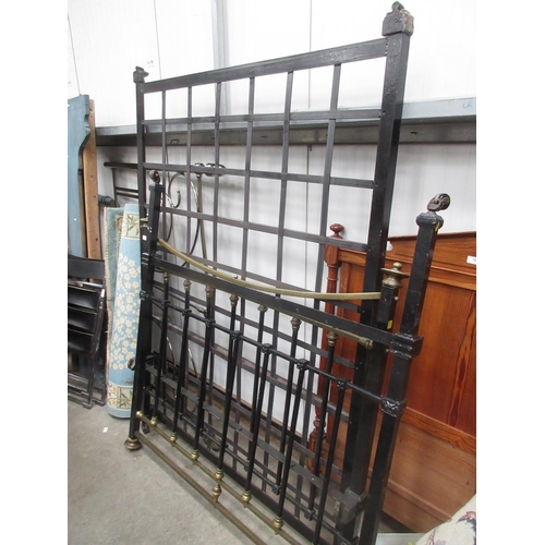 762 - A black painted iron and brass double Bedstead 4ft 6in W