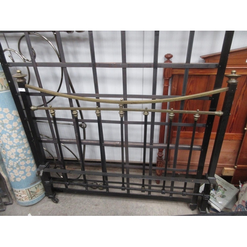 762 - A black painted iron and brass double Bedstead 4ft 6in W