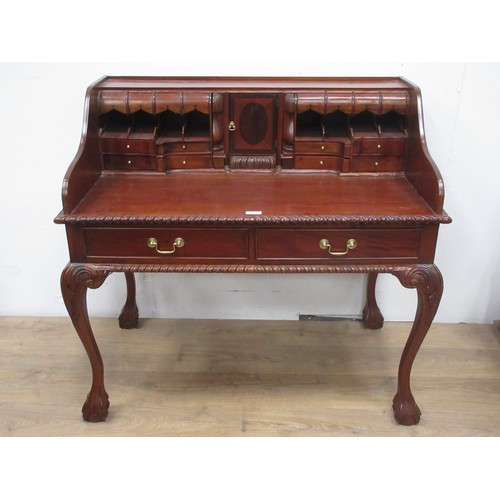 446 - A reproduction mahogany Desk with raised compartmented back fitted two frieze drawers and mounted up... 