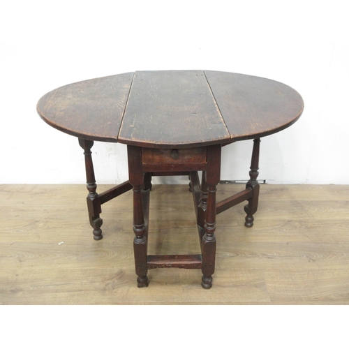 115 - A 17th Century oak Gateleg Table with oval top, fitted frieze drawer on turned supports, 3ft 3in