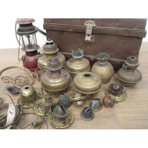 127 - A metal Trunk containing a quantity of brass and other oil Lamps