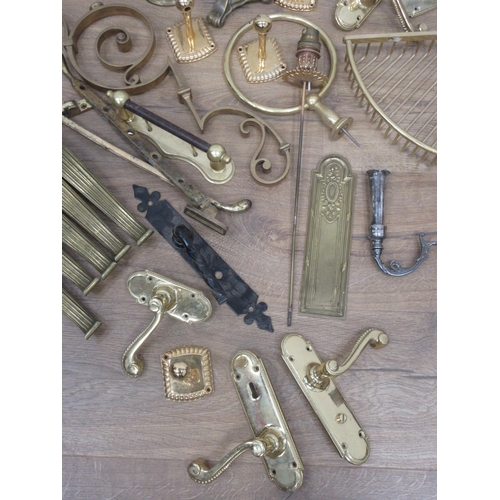 132 - A box of brass items including door handles, fittings etc