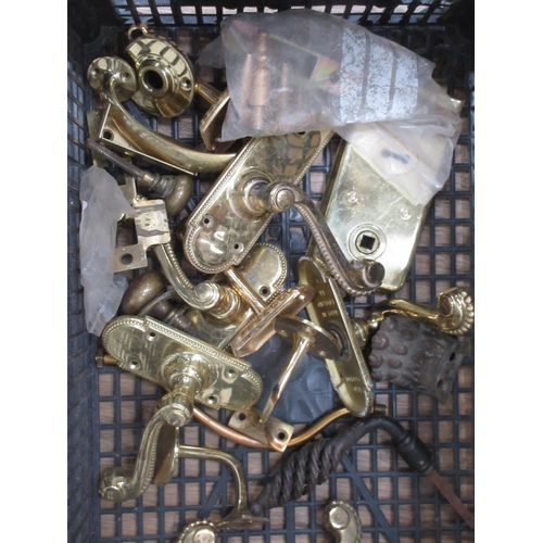 132 - A box of brass items including door handles, fittings etc