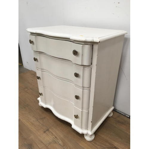 338 - A white painted Chest of four drawers with shaped drawer fronts, 2ft 6in W