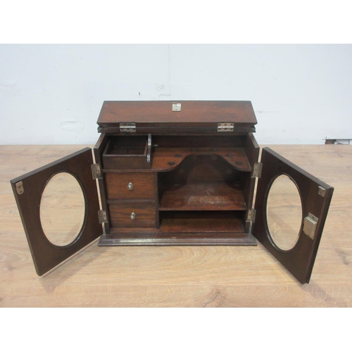 429 - An oak Smoker's Cabinet with pair of doors 15in W.