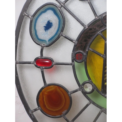 463 - A circular stained glass Window Panel with slices of mineral inserts.