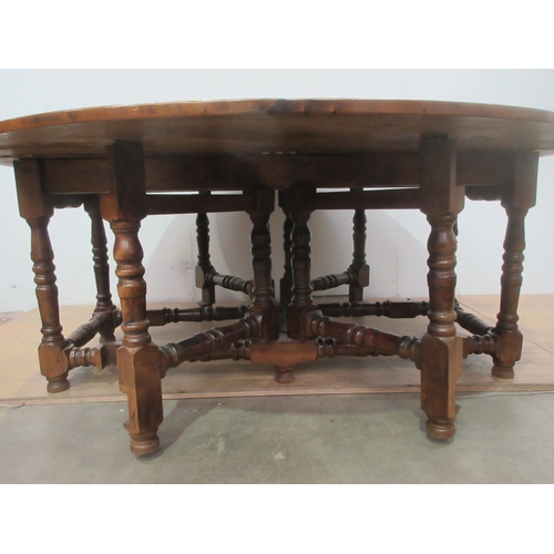 504 - A large walnut dropleaf gateleg Dining Table on turned supports and stretchers 5ft 11 in open x 6ft ... 