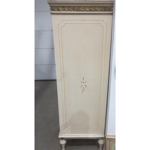 556 - A large painted five door Wardrobe the central door with cane panel above three drawers 8ft 5in W x ... 