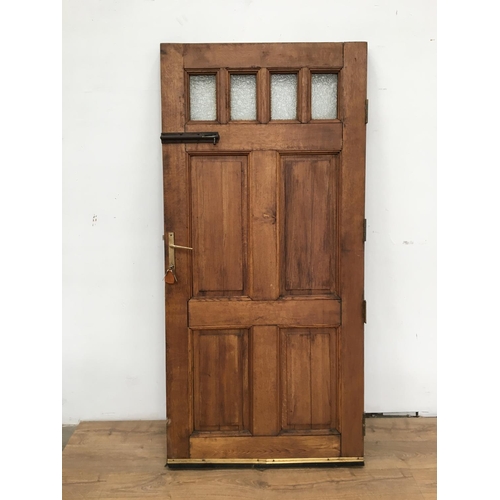 590 - An exterior Door with four small glass panels and panels below 6ft 4in H x 3ft W.