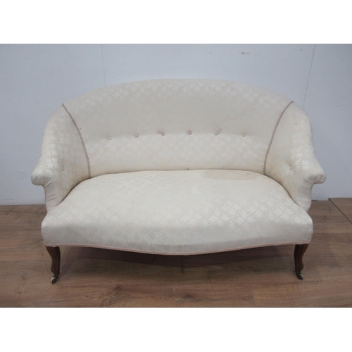 616 - A cream upholstered small Settee on shaped supports and casters 4ft 10 in W.