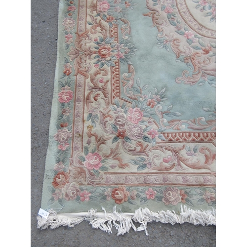 62 - A green Chinese Carpet with overall floral design 10ft 6in L x 8ft W