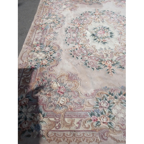 63 - A large pink ground Chinese Carpet with floral design 12ft 4in L x 8ft 10in W