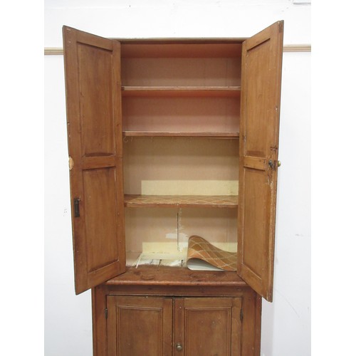 366 - A pine Cupboard with a  pair of panelled cupboard doors above another pair of cupboard doors, 7ft H ... 