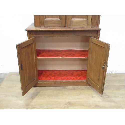 366 - A pine Cupboard with a  pair of panelled cupboard doors above another pair of cupboard doors, 7ft H ... 