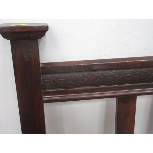 595 - A carved wooden Bedstead 4ft 6 W.