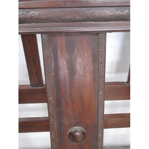 595 - A carved wooden Bedstead 4ft 6 W.