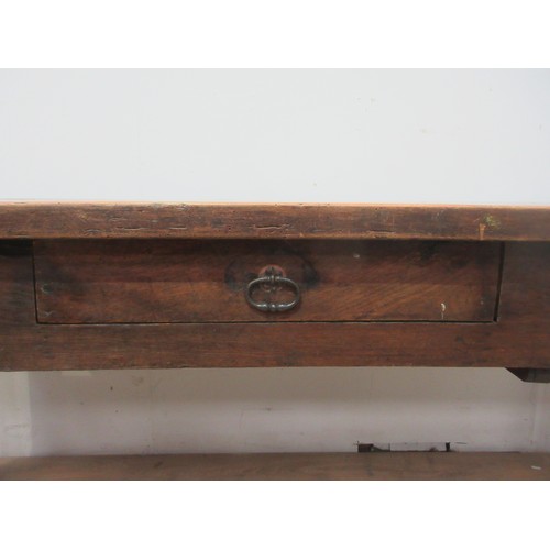 553 - An antique fruitwood top Refectory Table on oak base fitted two drawers on chamfered supports 6ft 11... 