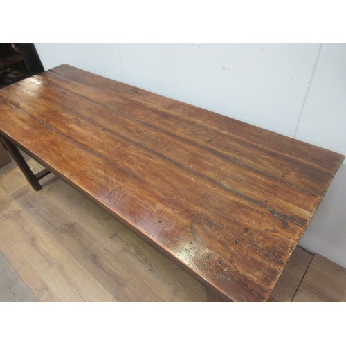 553 - An antique fruitwood top Refectory Table on oak base fitted two drawers on chamfered supports 6ft 11... 