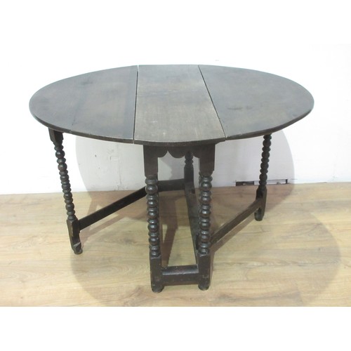 375 - A 17th Century oak Gateleg Table with oval top, raised on bobbin turned supports and squared stretch... 