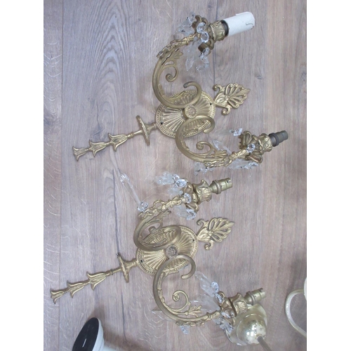 471 - Two brass effect Chandeliers and a pair of Wall Lights.