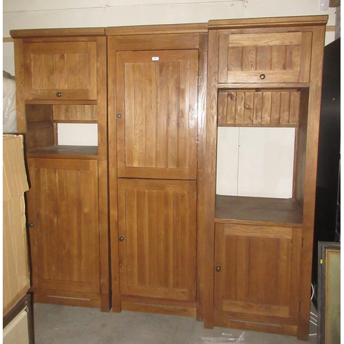 483 - An oak effect three section Kitchen Unit 6ft 11 in H x 7ft W approx.