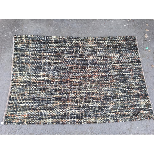 583 - A modern woven multicoloured Rug, 7ft 10in x 5ft 2in.