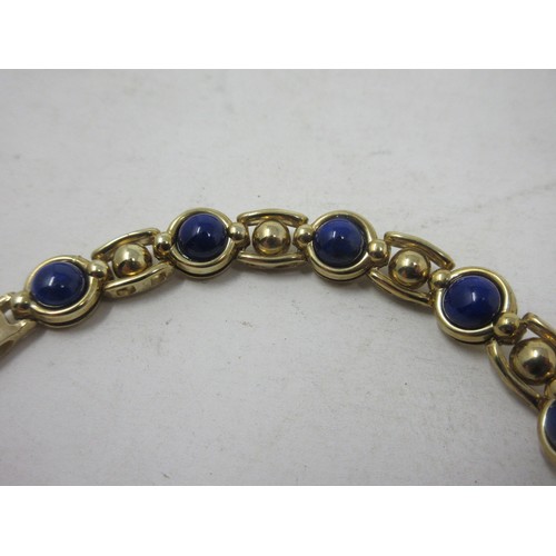 184 - A 9ct gold fancy link Bracelet set lapis lazuli beads, approx 15 gms all in.