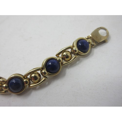 184 - A 9ct gold fancy link Bracelet set lapis lazuli beads, approx 15 gms all in.