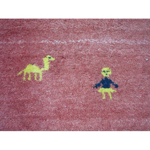 559 - A modern Rug with figure and animal motifs.