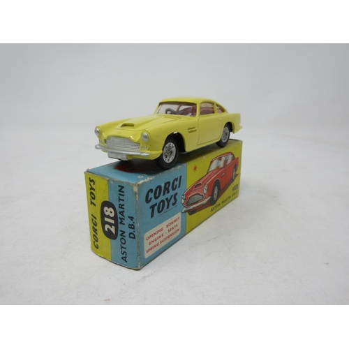 131 - A boxed Corgi Toys No.218 yellow Aston Martin D.B.4