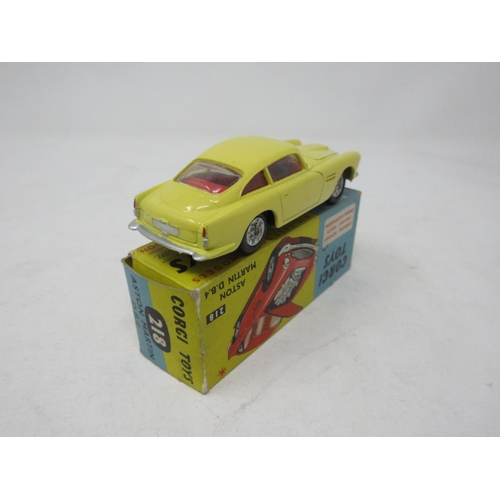 131 - A boxed Corgi Toys No.218 yellow Aston Martin D.B.4