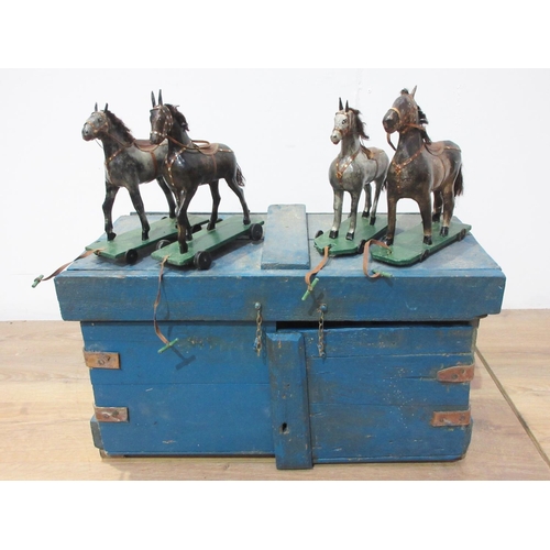 142 - An antique Folk Art blue painted pine Stable with four stalls, each containing a papier mache horse ... 