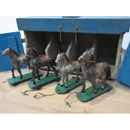 142 - An antique Folk Art blue painted pine Stable with four stalls, each containing a papier mache horse ... 