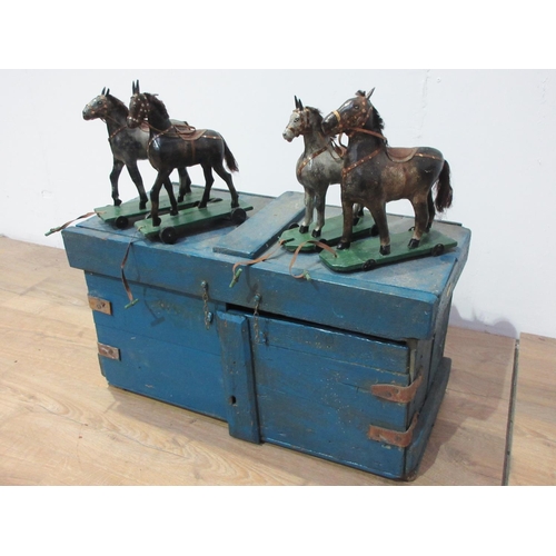 142 - An antique Folk Art blue painted pine Stable with four stalls, each containing a papier mache horse ... 