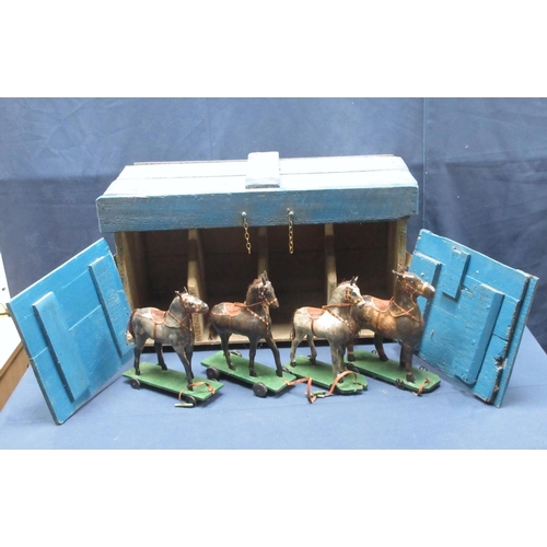 142 - An antique Folk Art blue painted pine Stable with four stalls, each containing a papier mache horse ... 