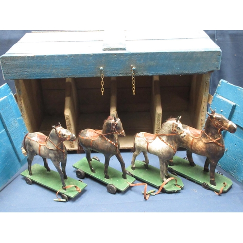 142 - An antique Folk Art blue painted pine Stable with four stalls, each containing a papier mache horse ... 