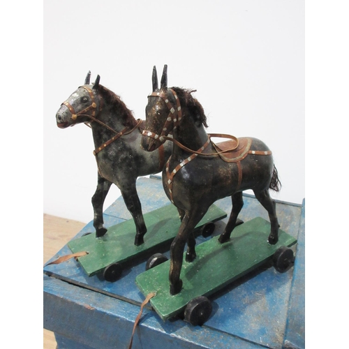 142 - An antique Folk Art blue painted pine Stable with four stalls, each containing a papier mache horse ... 