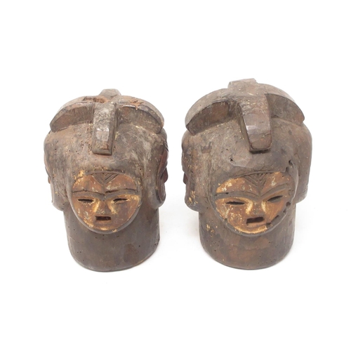 241 - A pair of West African ceremonial Carvings with four white painted faces 8in H