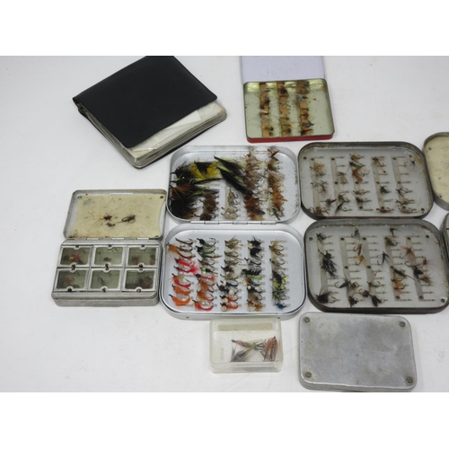 322 - Five Fly Tins containing damaged trout flies, another tin of Flies and a Rig Wallet