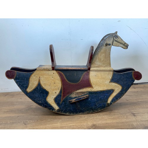 206 - A late 19th Century carved and painted pine Rocking Horse 3ft 6in L x 2ft H approx.