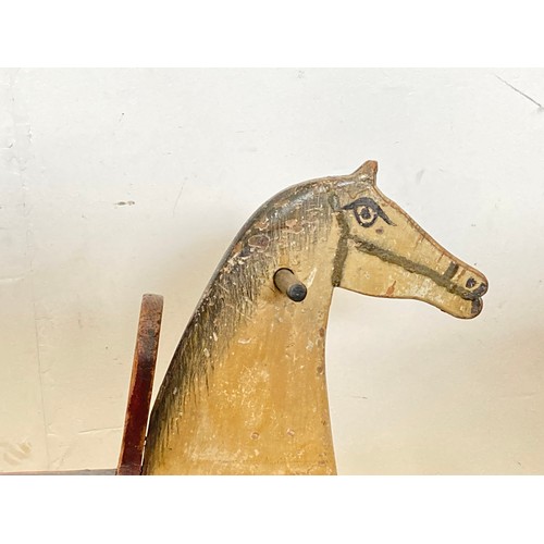 206 - A late 19th Century carved and painted pine Rocking Horse 3ft 6in L x 2ft H approx.