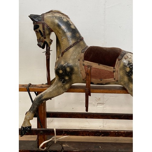 207 - A 19th Century dapple grey Rocking Horse by J.R. Smith with cushioned saddle on stained pine base 3f... 