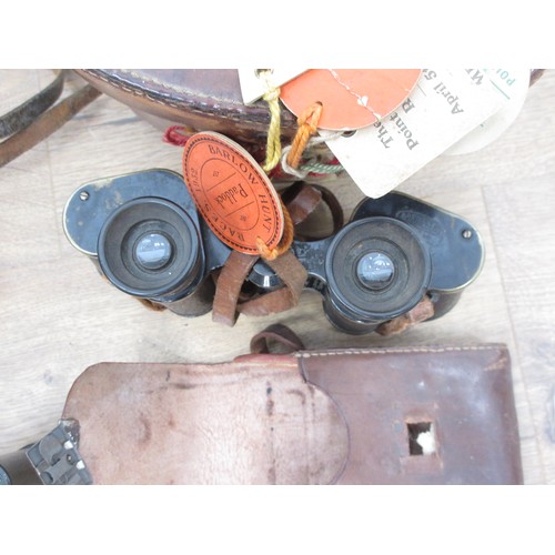 240 - A pair of military Binoculars stamped Bino. prism Mk II No.77506 in leather case, a pair of Zeiss Bi... 