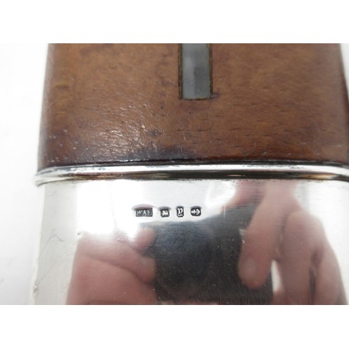 426B - A silver and leather Hip Flask (lid A/F) 7in H and a plated and leather Hip Flask 6 1/2in H