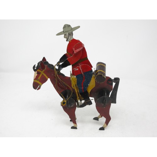 224 - An unusual 1950's British painted metal Canadian Mountie