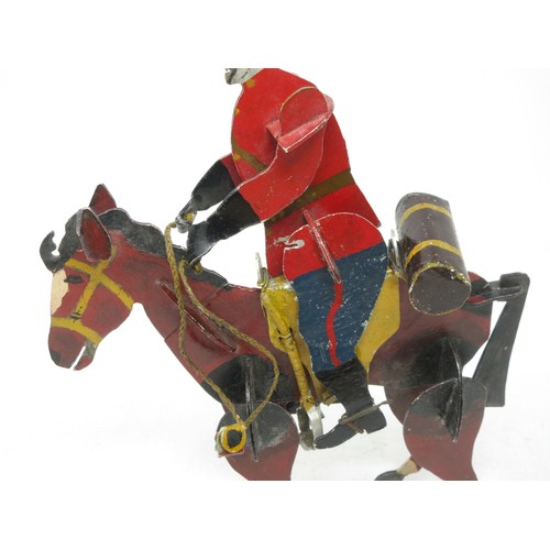 224 - An unusual 1950's British painted metal Canadian Mountie