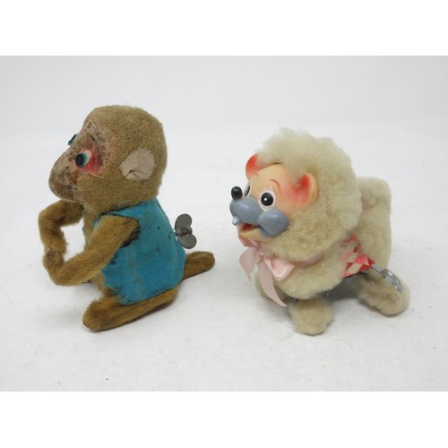 227 - A clockwork Monkey in blue jacket and a Japanese clockwork Poodle