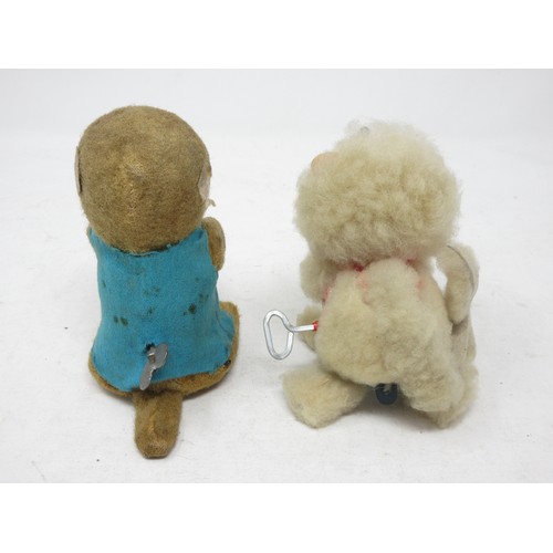 227 - A clockwork Monkey in blue jacket and a Japanese clockwork Poodle