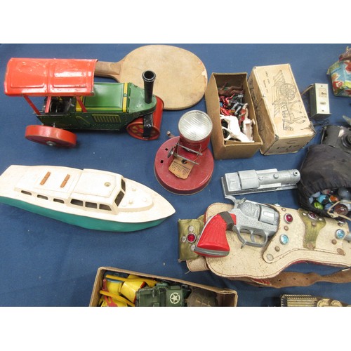 49 - A quantity of toys including clockwork tinplate Steam Roller, Penguin, plastic Motor Boat, Pistols, ... 